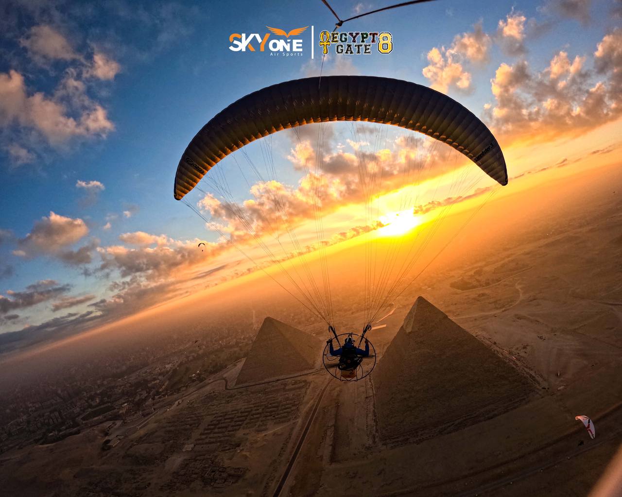 Paramotor over the Pyramids at sunset