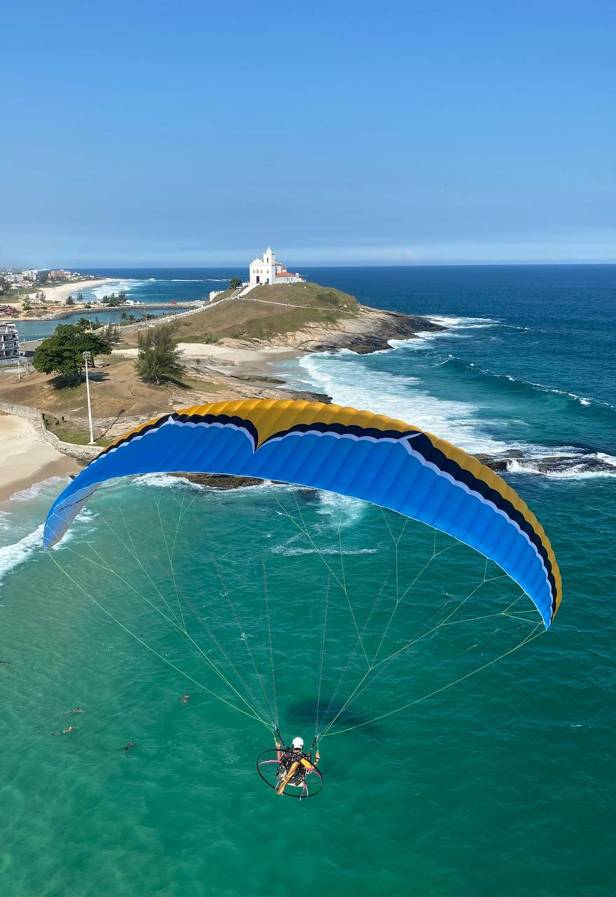 Paramotor flight along the coast at golden hour